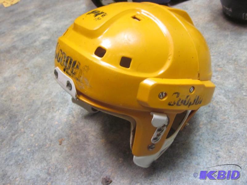 Yellow Cooper hockey helmet.&nbsp  &nbsp  &...