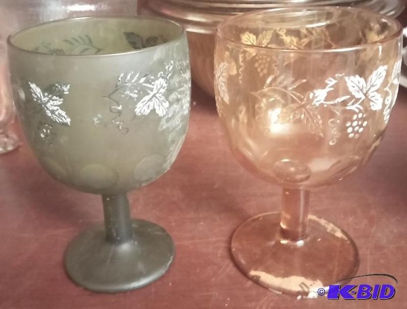 Large amber wineglass and large green wine gl...