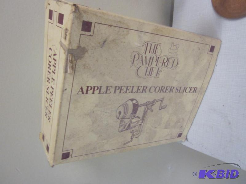 lot 68 image: Pampered Chef peeler, in box.      ...