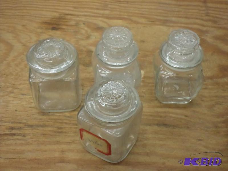 4 bench alcohol bottles with stoppers...