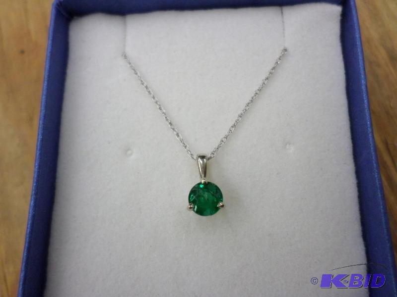 .38ct Emerald 14kt white gold pendant, with a...