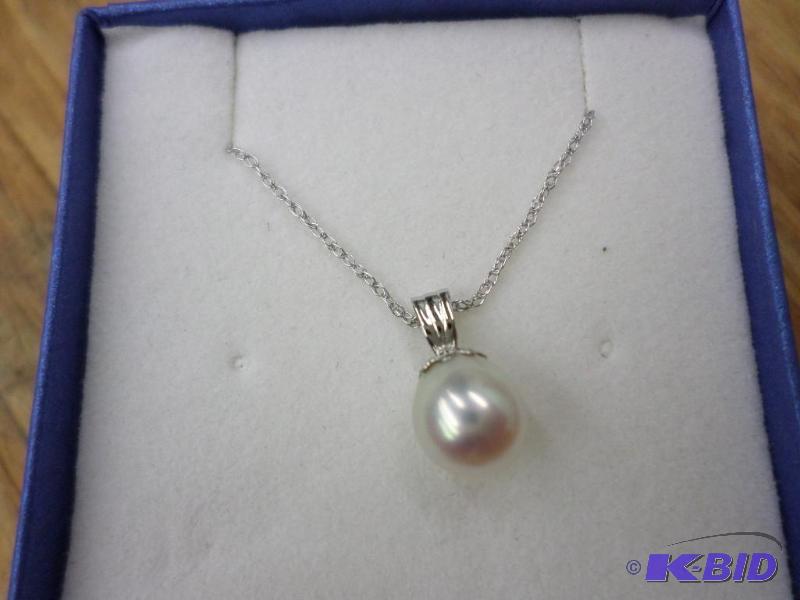7mm Tear Drop Cultured Pearl pendant with a 1...
