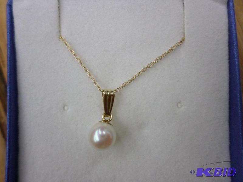 5.5mm Cultured Pearl pendant with a 14kt yell...