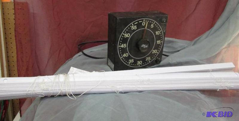 white window blinds, darkroom timer...