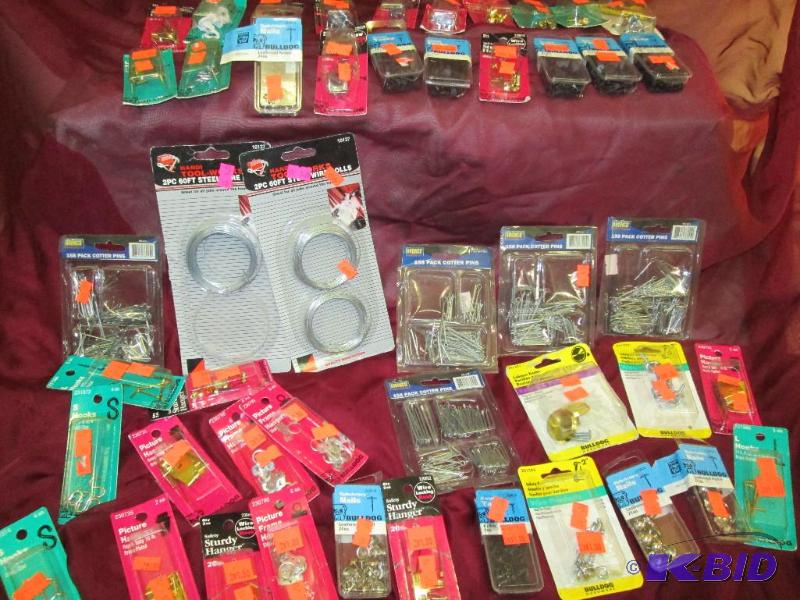 various packages of hooks, nails, picture hoo...