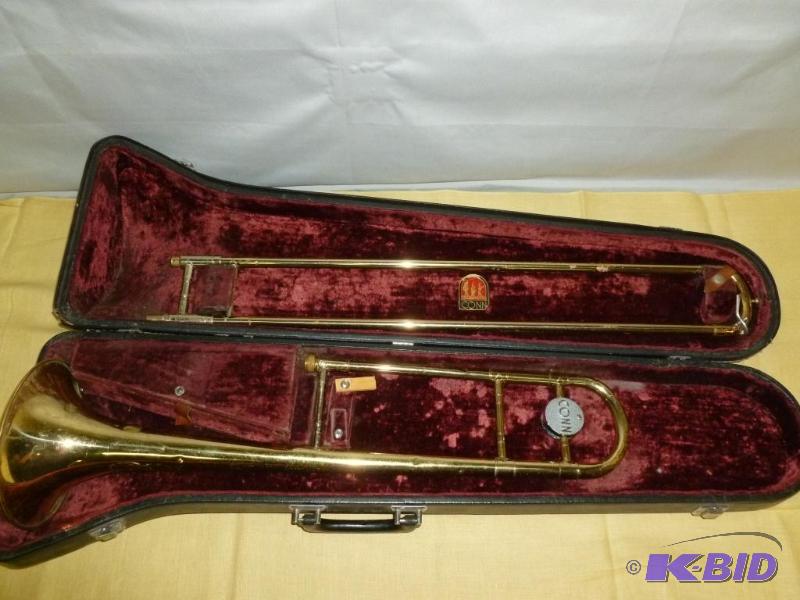 lot 11 image: Vintage Conn Trombone, comes with a Conn 3 mo...