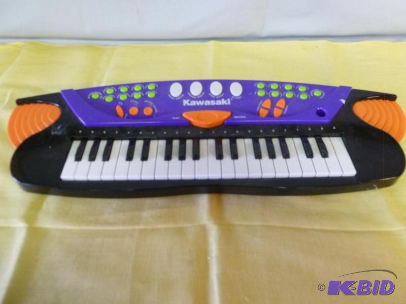 lot 174 image: Kawasaki battery operated piano that measures...