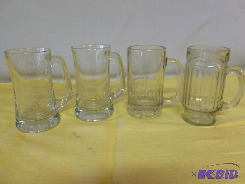 lot 201 image: Lot of four heavy glass beer mugs....