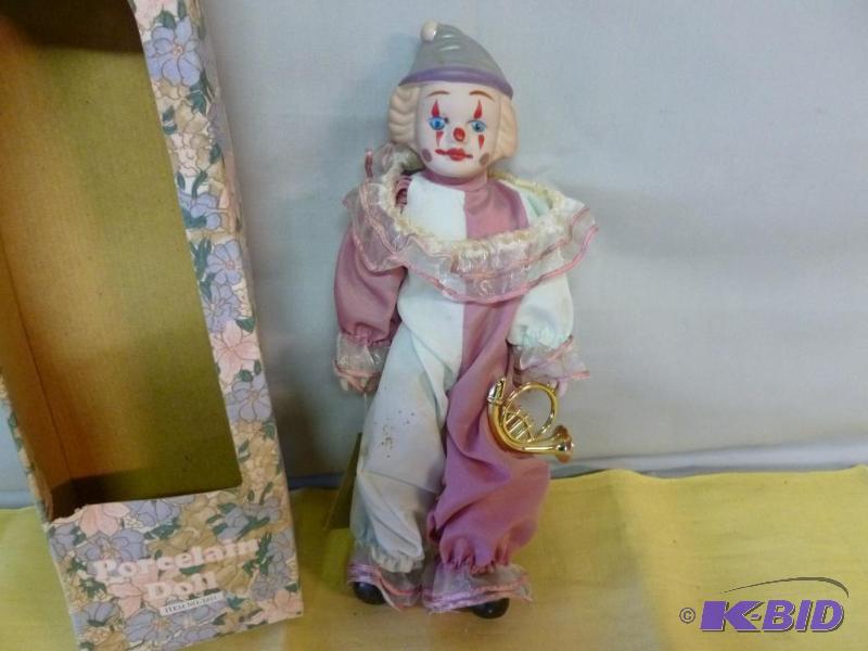 lot 45 image: Clown porcelain doll that measures 14" H...