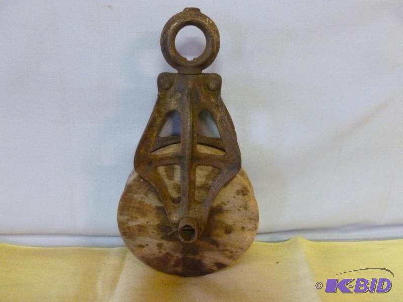 lot 87 image: Vintage iron bodied and wooden wheel barn pul...