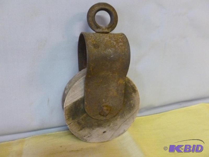 lot 90 image: Vintage iron bodied and wooden wheel barn pul...