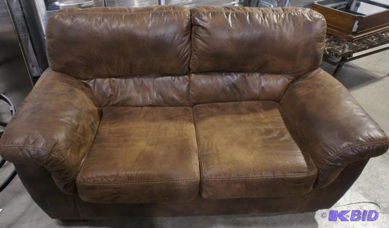 Ashley Sofa - Dark Brown in color - MSRP $899...