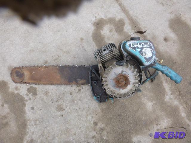 lot 136 image: Vintage Bobcat Chainsaw Motor is free....