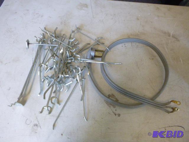 lot 20 image: Dryer Cord and Miscellaneous Peg Board Hooks...