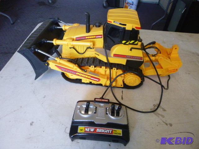lot 21 image: Toy Remote Skid Loader...