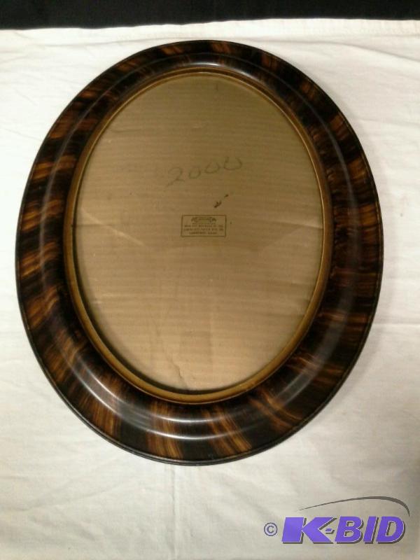 lot 111 image: Vintage oval bubble glass tiger frame