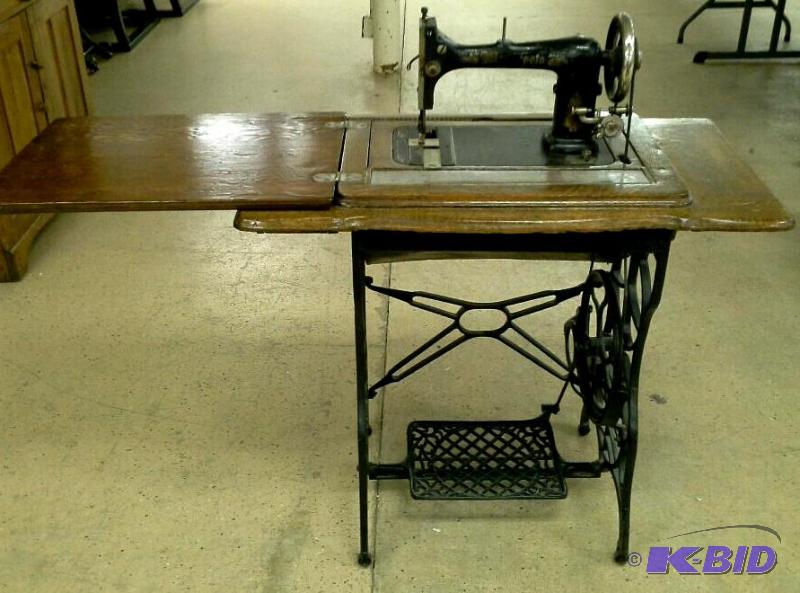 lot 73 image: Antique wood and wrought iron sewing machine