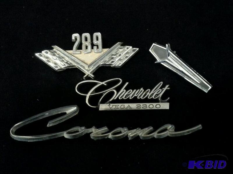 lot 94 image: Vintage Corona, Vega, 289 & Chrysler Car Emblems