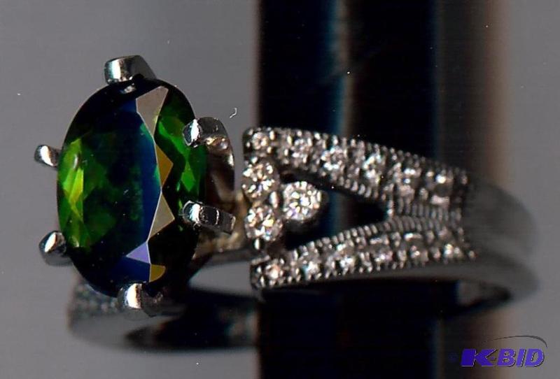 14K White gold ring center stone is a Green T...