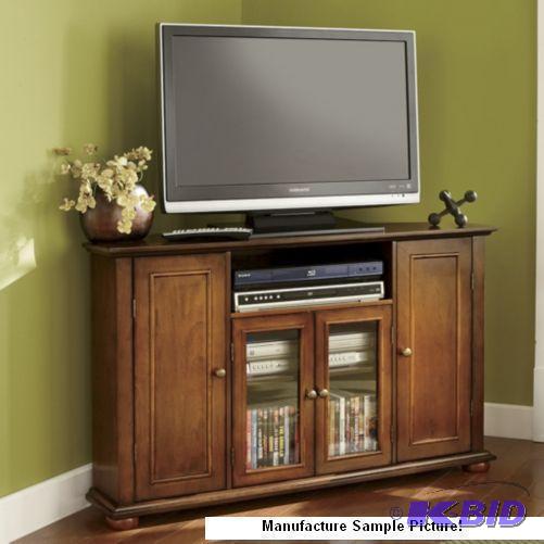 lot 275 image: Walnut Finish Corner TV Stand - Retail $ 229....