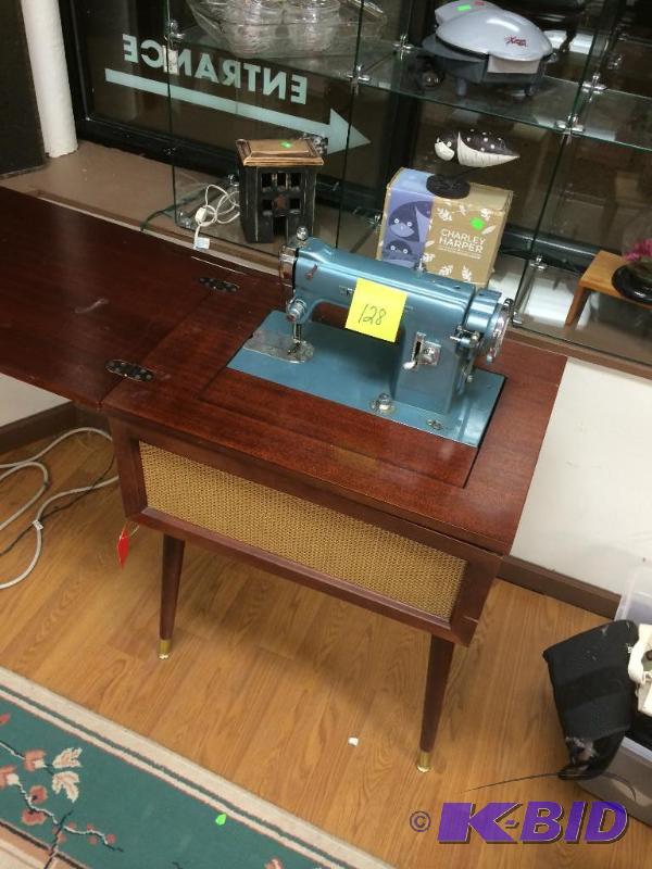 lot 128 image: Kenmore sewing machine and cabinet