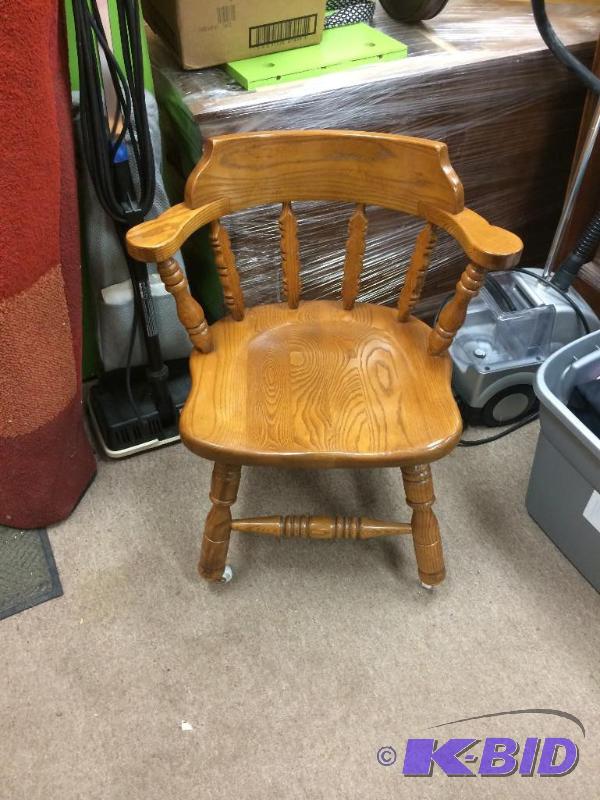 lot 50 image: Oak sitting chair on wheels