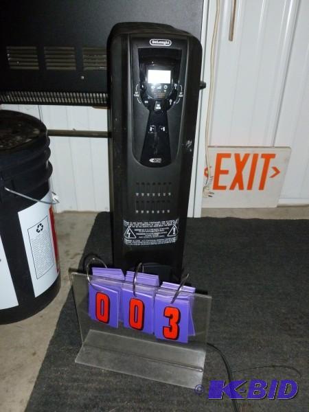 lot 3 image: Delonghi radiant heater. 120 volt. Appears ne...