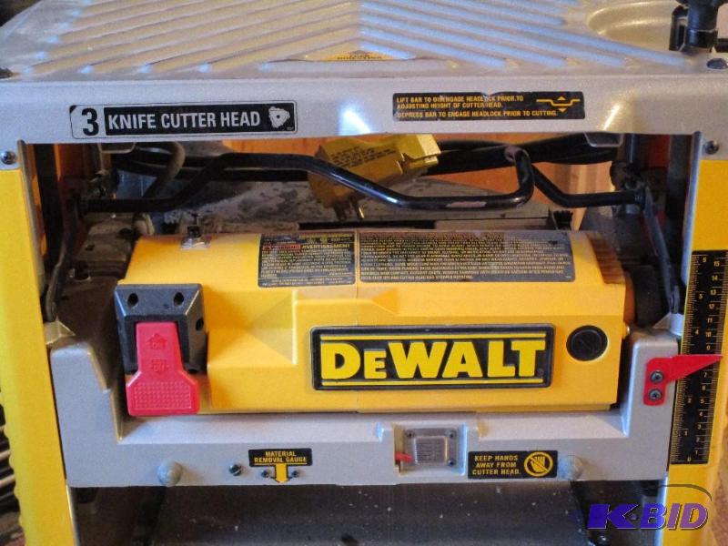 lot 48 image: DEWALT DW734 15 Amp 12-12-Inch Bench top Planer