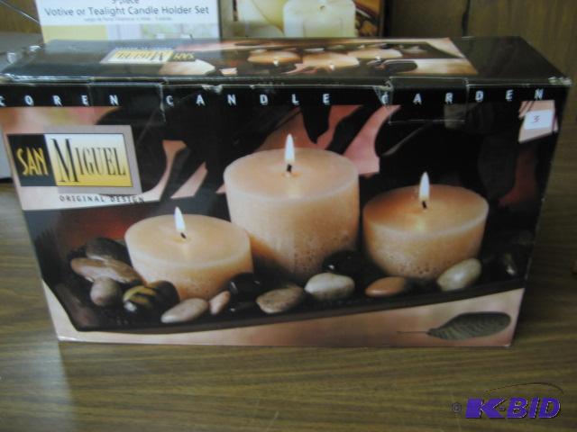 TRI OF RUSTIC PARCHMENT PILLAR CANDLES ATOP A...