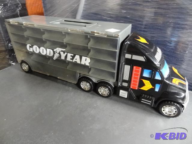 lot 131 image: Goodyear Plastic Truck. Die Cast Car hauler...