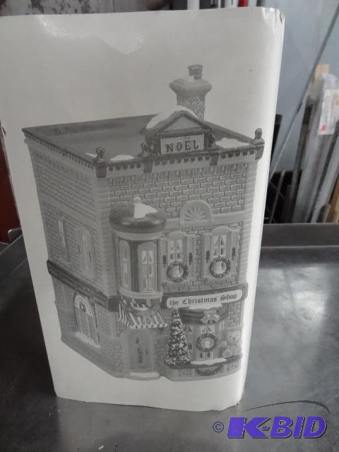 lot 211 image: Dept 56 Snow Village. The Christmas Shop...
