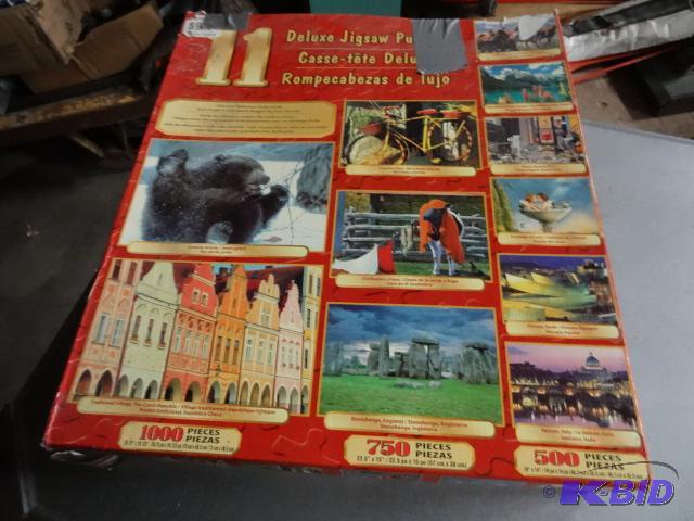 lot 73 image: Deluxe Jig Saw Puzzles...