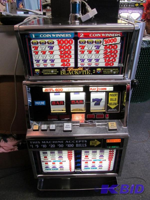lot 1 image: 1996 IGT Double Black Tie $.25 One Arm Bandit Slot Machine