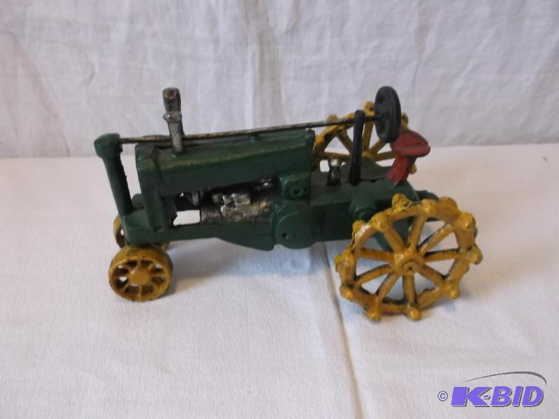 Vintage cast iron toy tractor measuring 8&quo...