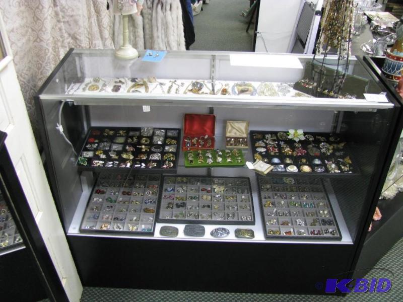 lot 53 image: this lot is a glass case the items inside ar...