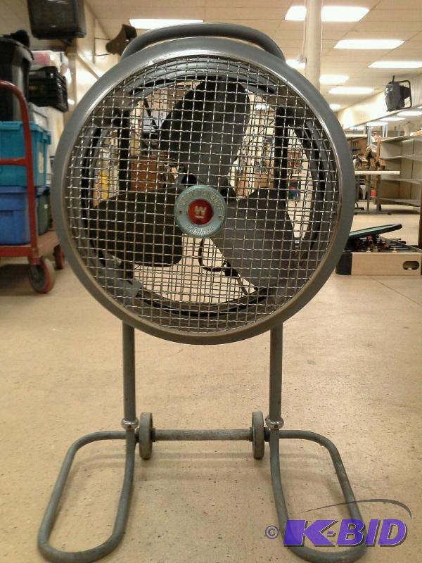 lot 3 image: Westinghouse industrial rolling floor fan.