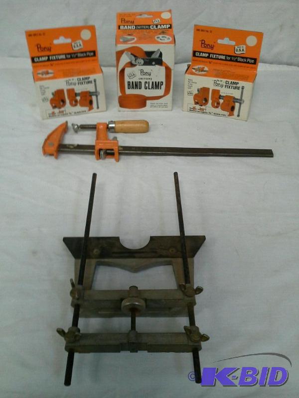 lot 34 image: Pony clamps fixtures for half inch black pipe Band (miter) clamp, various clamps