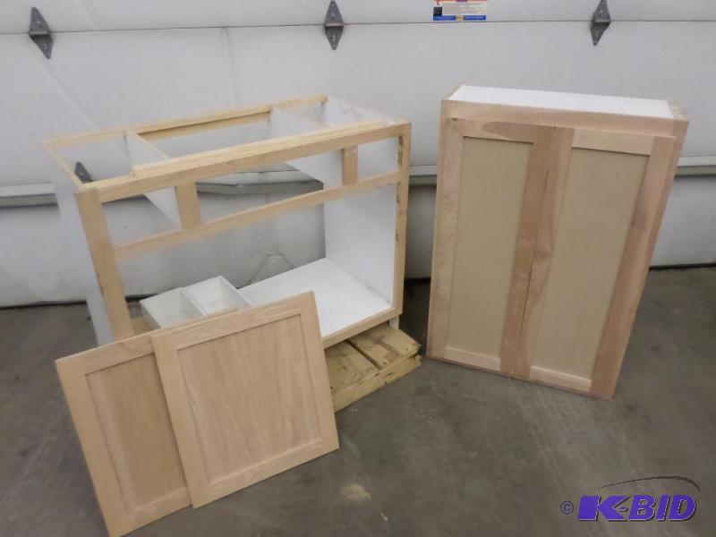 lot 28 image: (2) Unfinished Unused Wood Cabinets 12"...