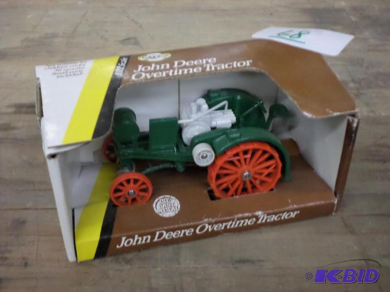lot 68 image: John Deere 132-Scale Overtime Tractor...