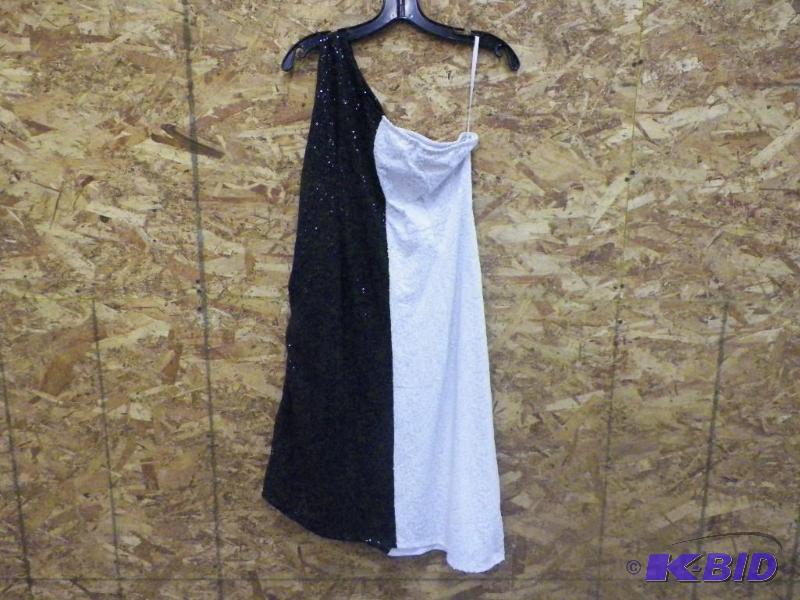 lot 322 image: Black  White Sequined Dresses