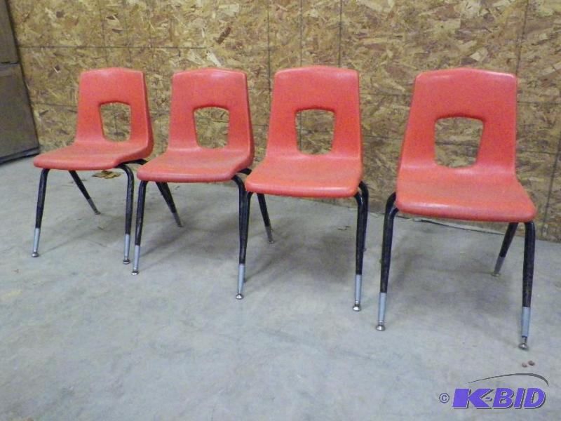 lot 74 image: Orange student chairs