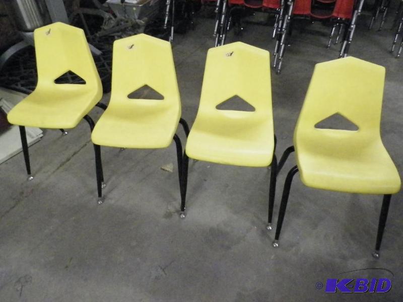 lot 79 image: Yellow student chairs