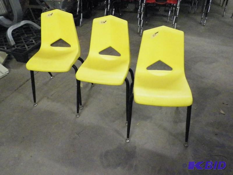 lot 80 image: Yellow student chairs