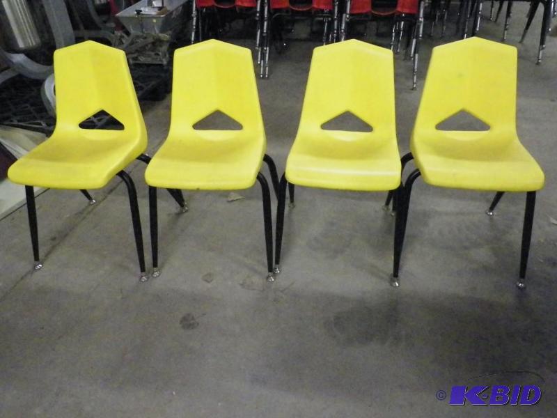 lot 84 image: Yellow student chairs