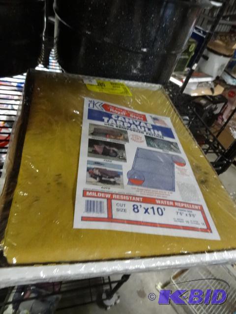 lot 87 image: New 8 foot x 10 foot canvas tarp. Includes a ...