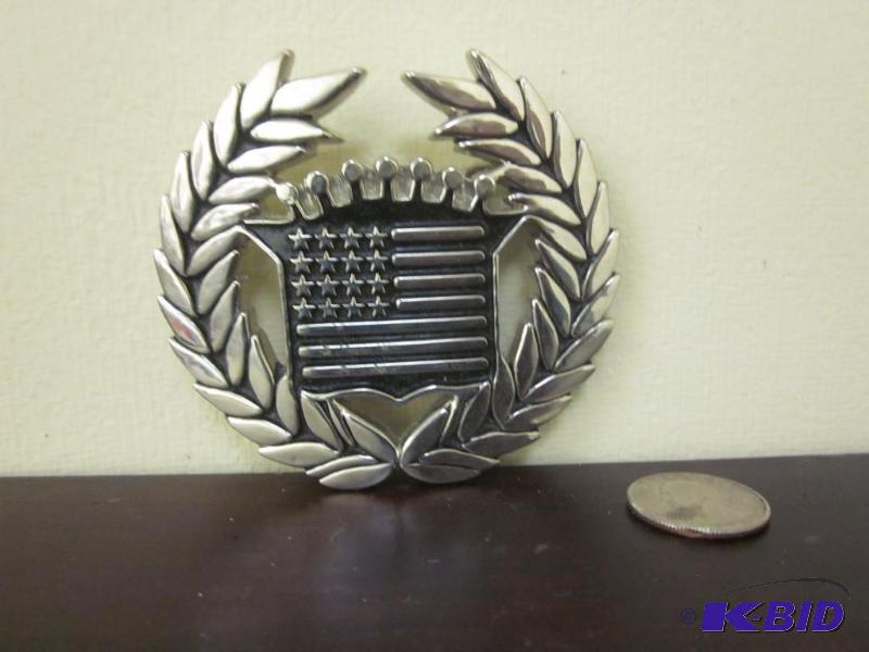lot 43 image: Famous Stars and Strips belt buckle.   &...