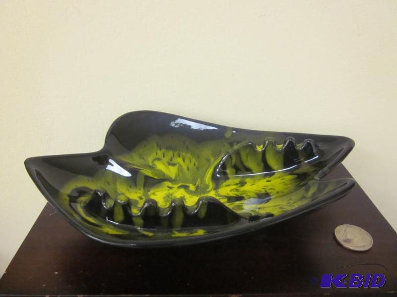 lot 58 image: Mid Century black and yellow glaze footed ash...
