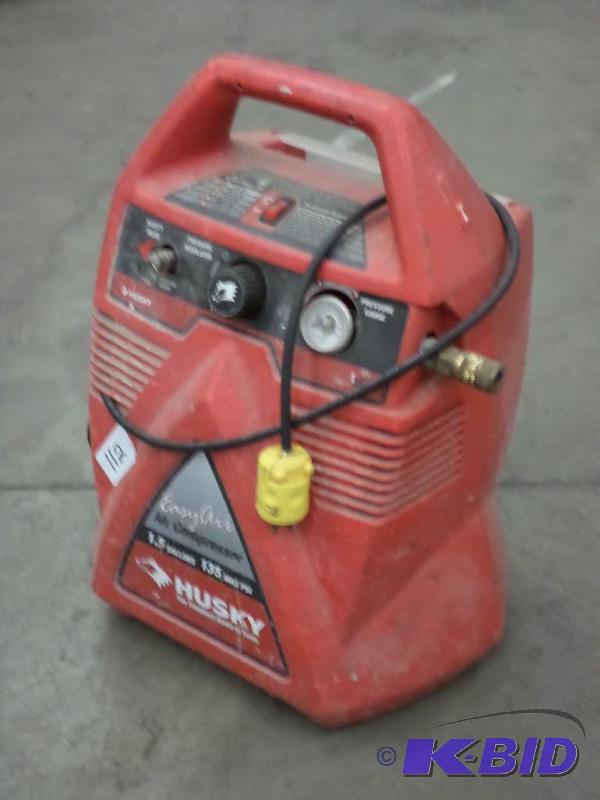 lot 112 image: Husky 1.5-Gallon 135PSI Electric Air Compress...