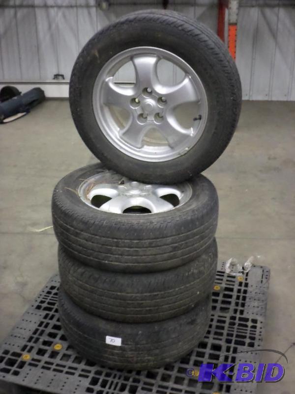 lot 70 image: (4) 5-Lug Ford 4.5" Rims With P2156016...