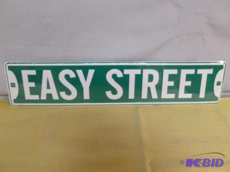 lot 21 image: Easy Street embossed metal sign that measures...